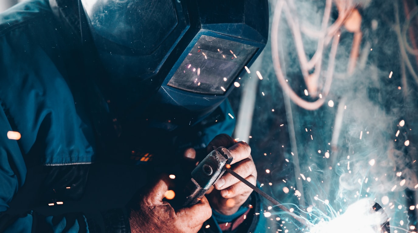 MONDI piping installation — TIG welder bonding stainless-steel pipe